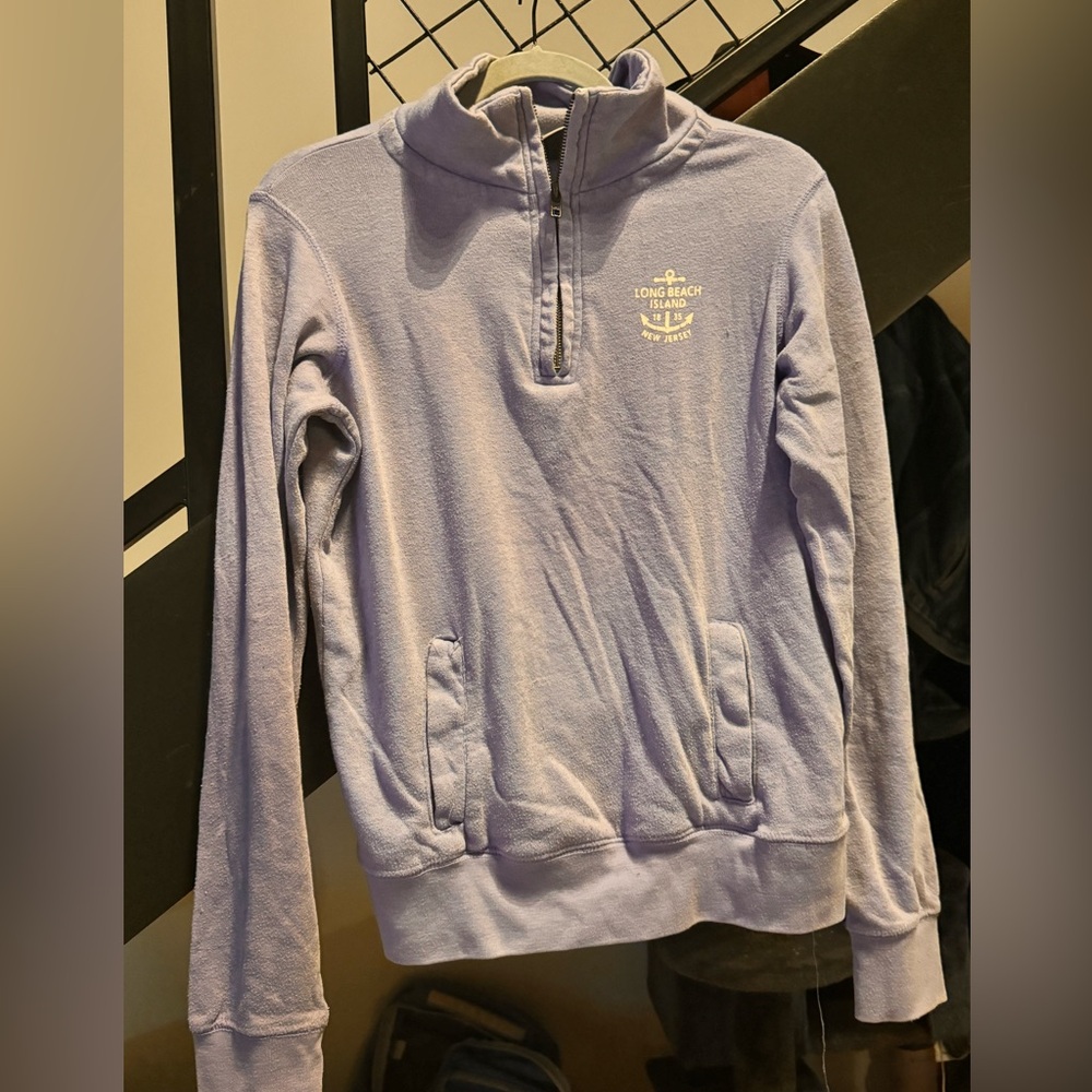 Periwinkle quarter zip with LBI logo and kangaroo pocket
